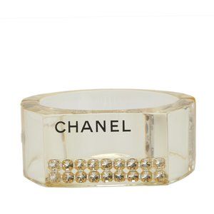 CHANEL logo bangle in yellow, clear plastic with rhinestones, for women.